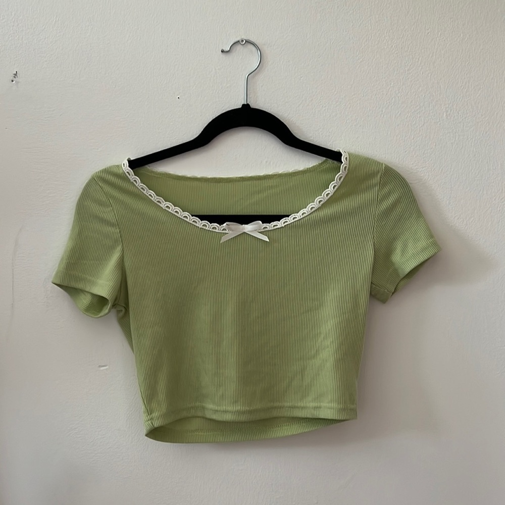 A cropped green t-shirt with a lace design on neckline, never worn from SHEIN.